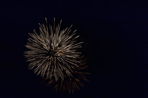 White Fireworks in the Sky during Night Time