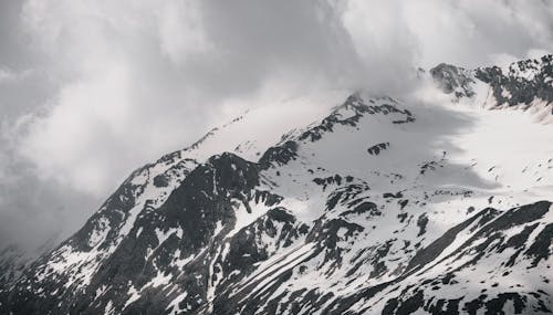 Foto profissional grátis de cênico, céu nublado, com frio