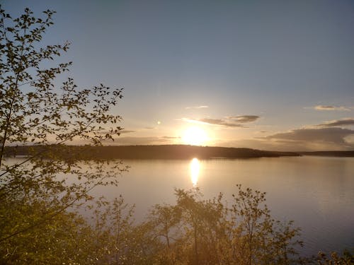 Gratis stockfoto met gouden zonsondergang, horizon over water