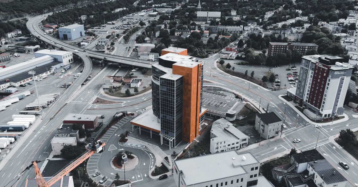 Drone photograph showcasing a cityscape with modern buildings and infrastructure.