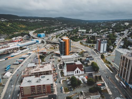 Free Stunning aerial capture of a bustling city with views of roads and buildings. Stock Photo