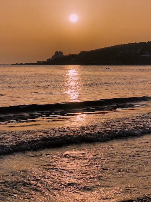 Безкоштовне стокове фото на тему «берег моря, вертикальні постріл, Захід сонця» стокове фото