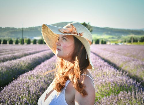 A Woman Wearing Sun Hat Looking Up