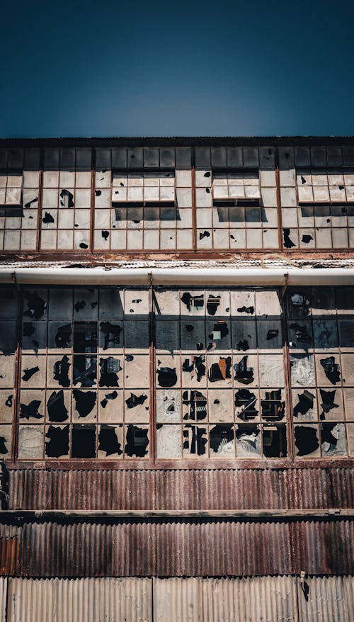 Old Building with Broken Glass Windows