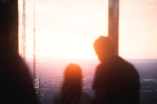 Free Silhouette of a couple gazing at the sunset over New York City skyline. Stock Photo