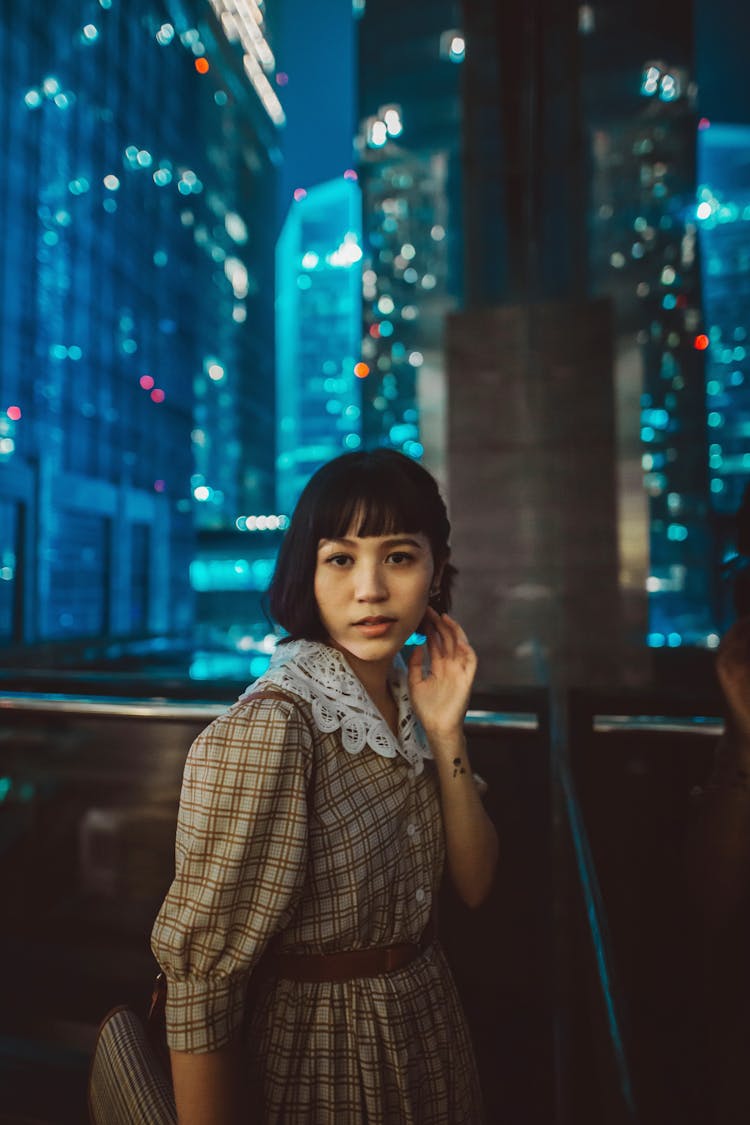 Fashion Girl In Classic Checkered Dress With White Collar