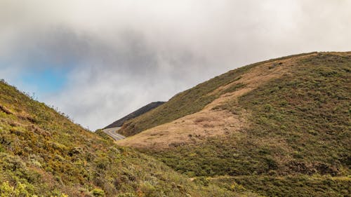 An Aerial Photography of a Mountain Under the White Sky