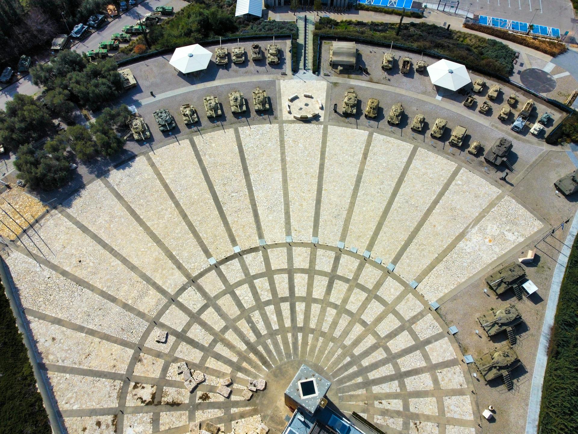 Drone shot of military vehicles displayed outdoors in a museum, Jerusalem, Israel.
