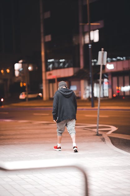 Peson Walking at Night in the City · Free Stock Photo