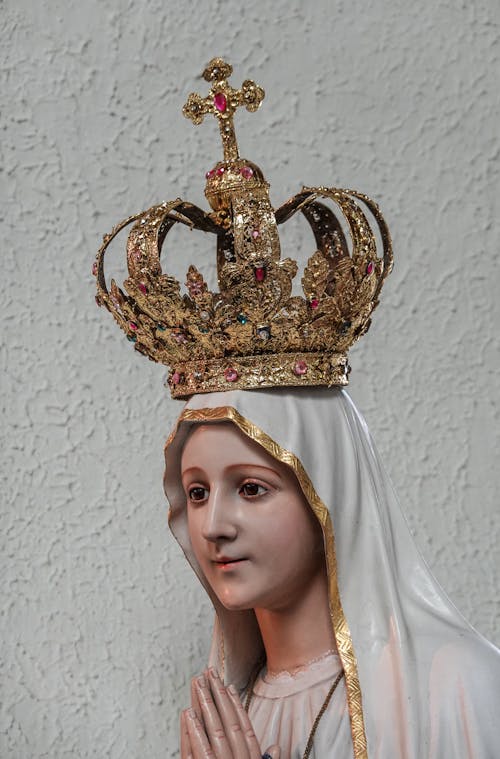 Close Up Photo of Statue of Virgin Mary Wearing Golden Crown