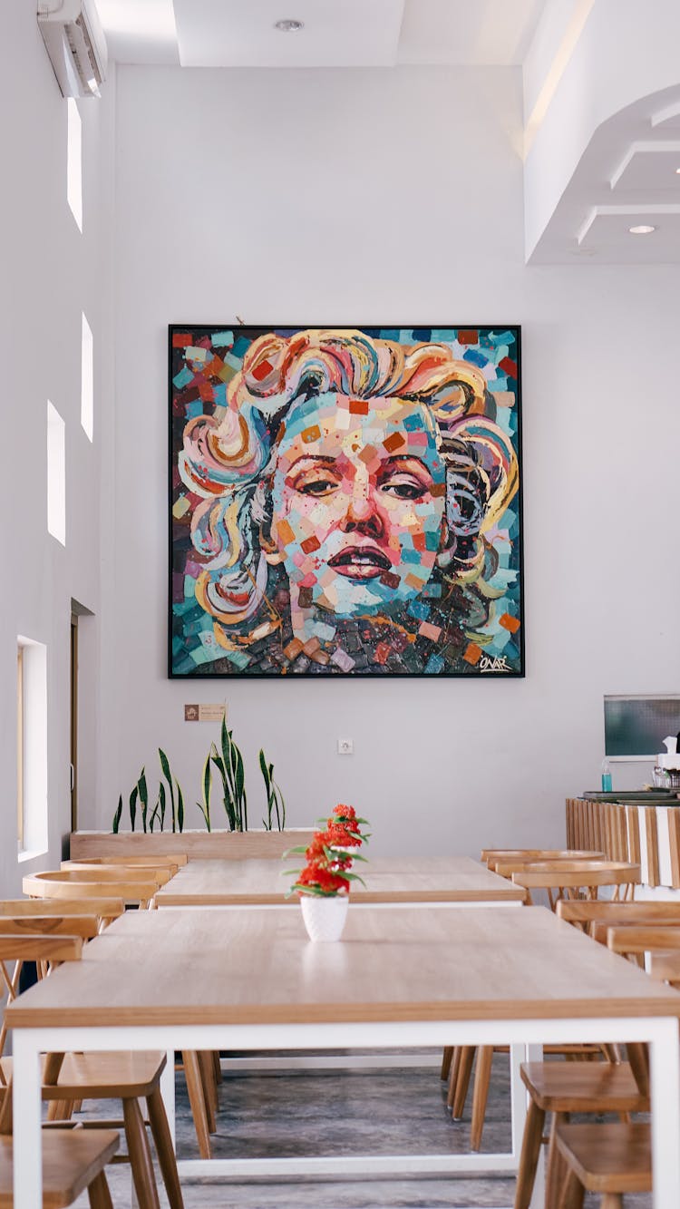 Dining Room With Modern Art Painting On Wall