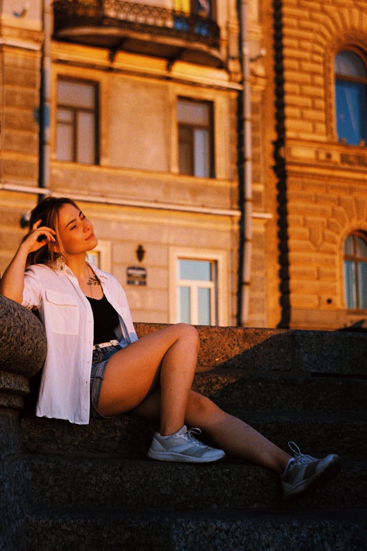 Woman In Shirt Posing At Sunset