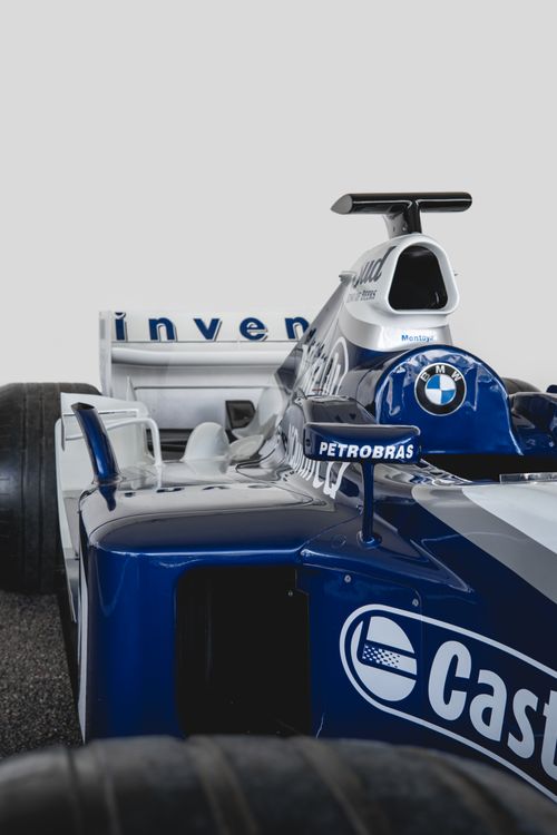 Free Detailed shot of a blue and white Formula 1 race car, highlighting its design and branding. Stock Photo
