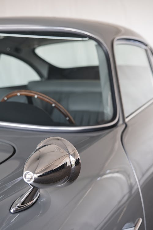 Side-View Mirror of a Clean Gray Vintage Car