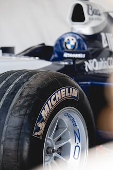 Detailed close-up of a Formula 1 car tire highlighting the Michelin branding, showcasing racing precision.