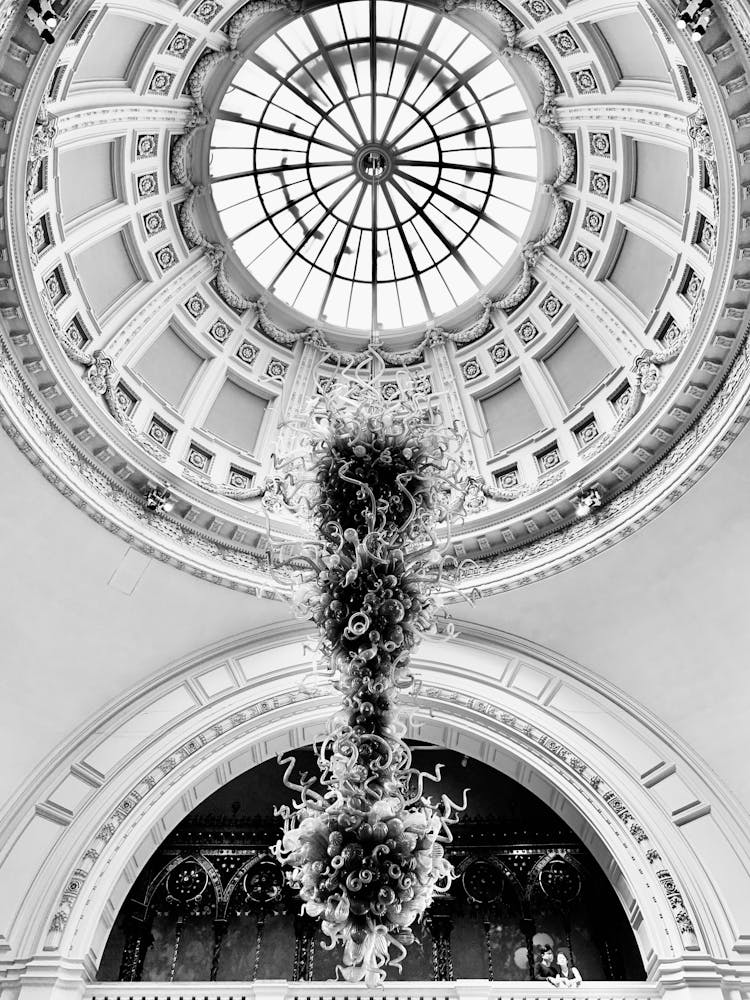 Grayscale Photo Of Rotunda Chandelier Inside Victoria And Albert Museum In London