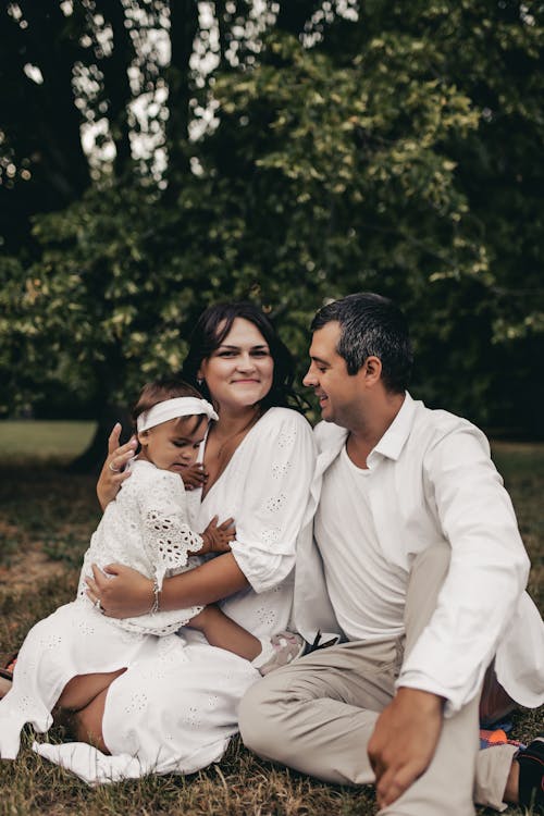 Couple Sitting With Child