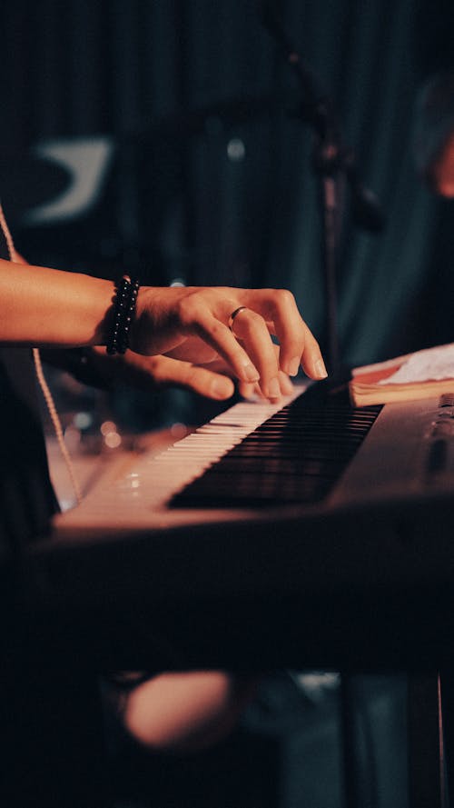 Close-up of Person Playing a Synthesizer 