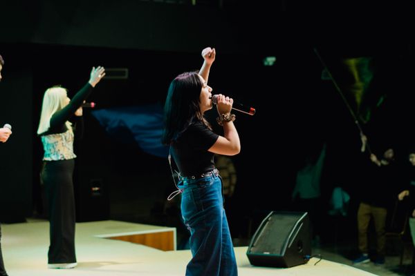 Singing live in front of an audience — photo by Elias Jara on Pexels