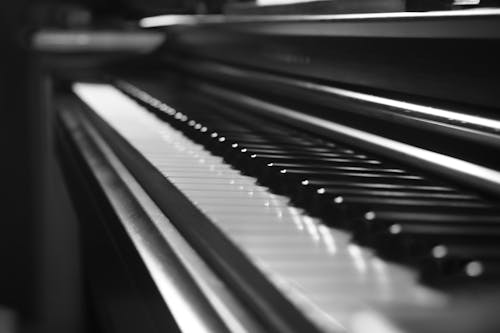 Grayscale Photo of a Piano