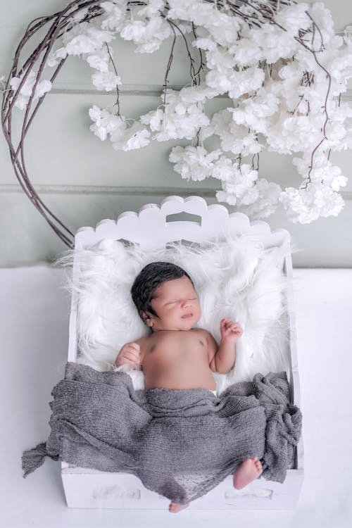 Free A Baby Sleeping on the Fur Bed Stock Photo