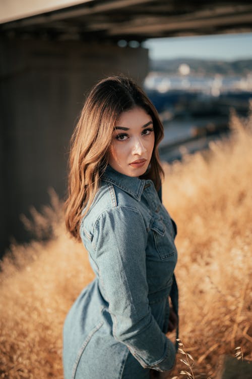 Close Up Photo of Woman in Denim Dress