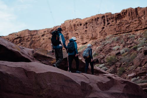 People Hiking on Brown Rocky Mountain