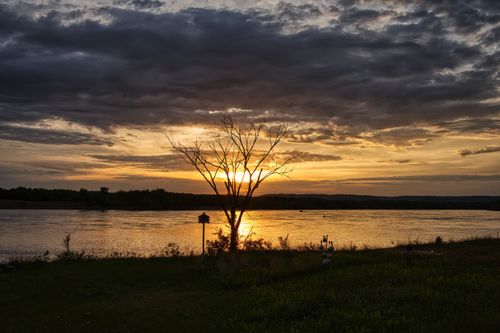 Free Tranquil sunset view over the Mississippi River in Reads Landing, Minnesota, captured with vibrant warm hues. Stock Photo