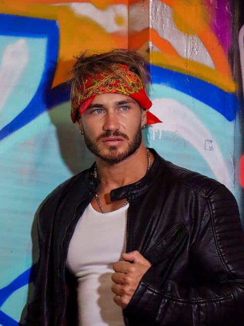 A Man Wearing a Bandana and Leather Jacket