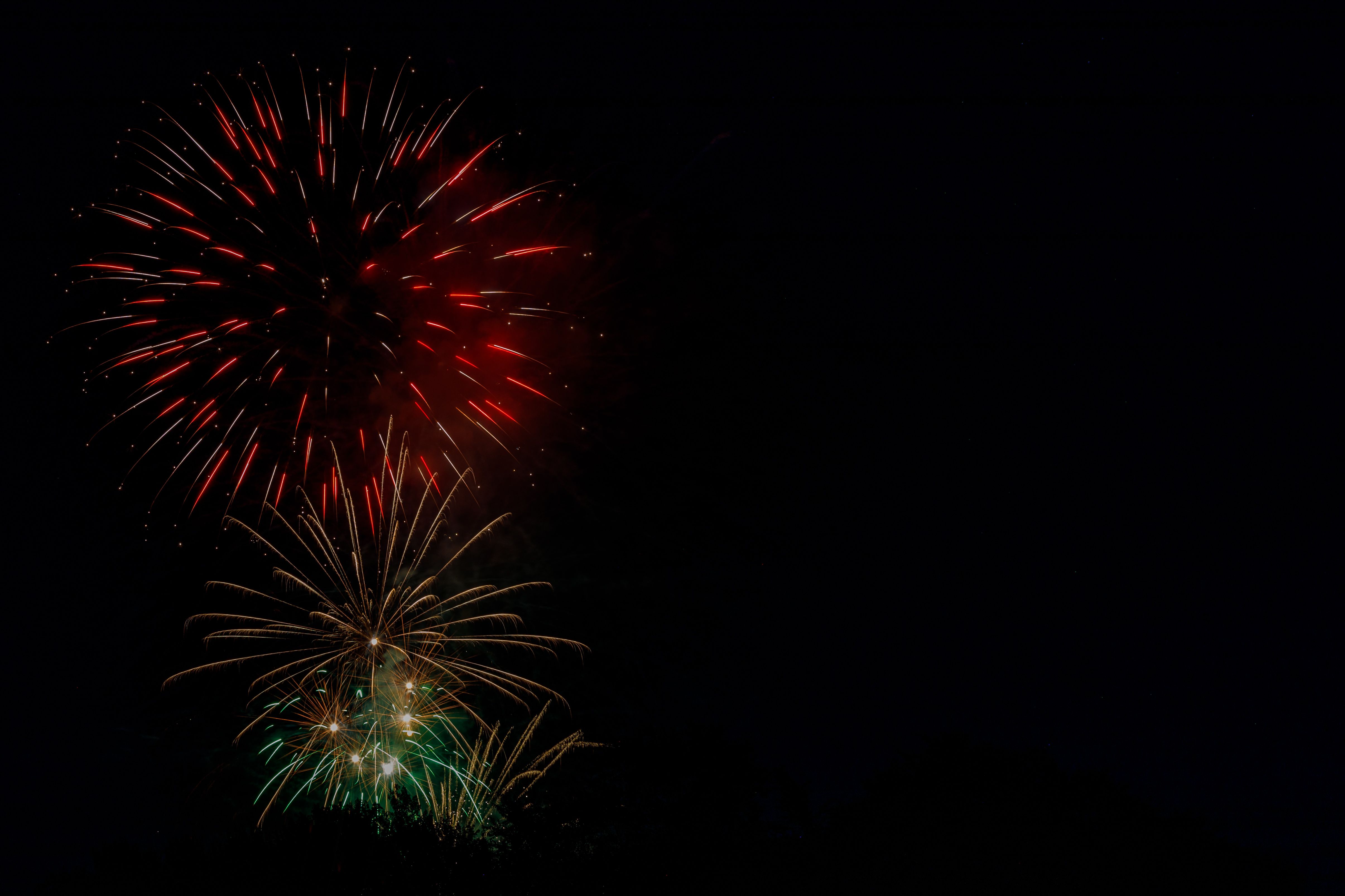 Colorful fireworks burst against a dark sky, capturing the essence of celebration and festivity.