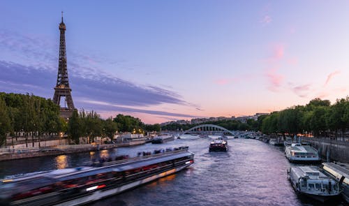 Photo of Paris with the Eiffel Towers and the Seine River at Sunset