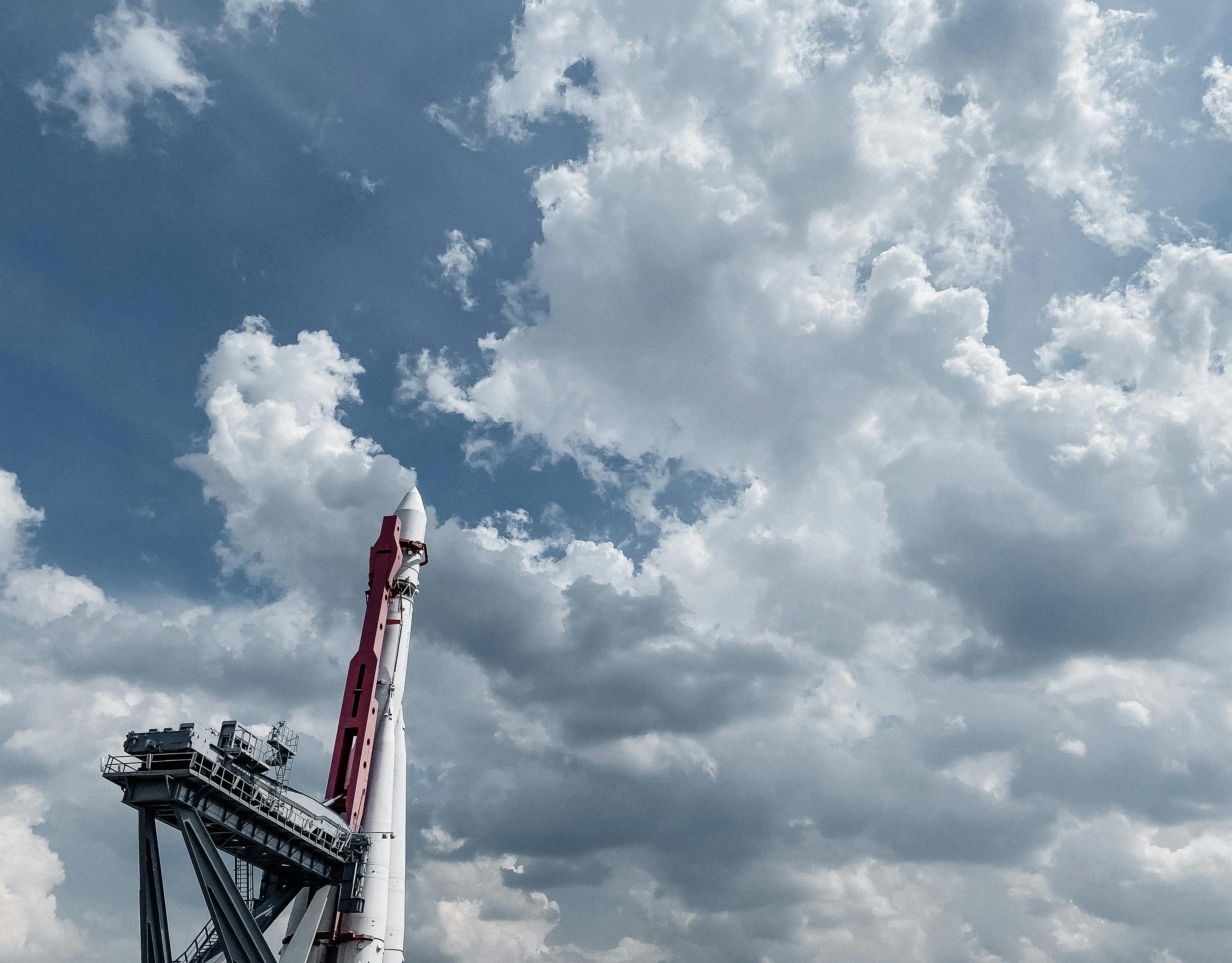 Vostok rocket displayed against a vibrant cloudy sky, showcasing engineering and space exploration.