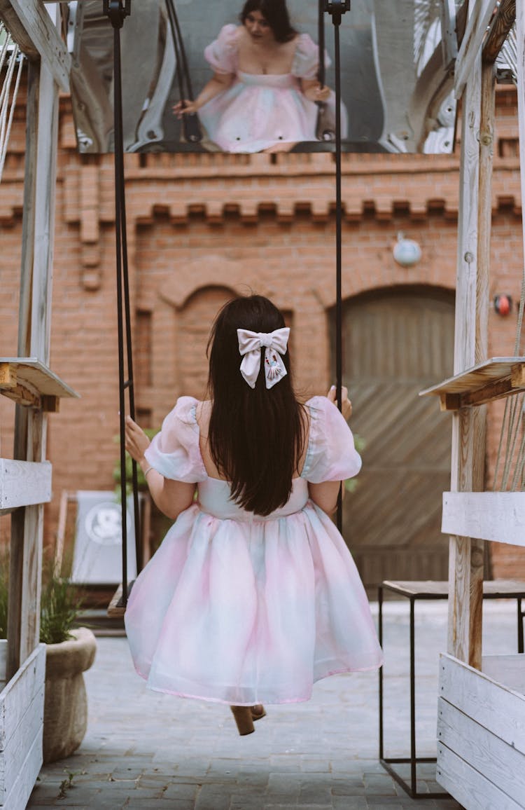 Woman Wearing Dress On A Swing