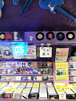 Explore a retro record shop in England showcasing vinyl and CDs under neon lights.
