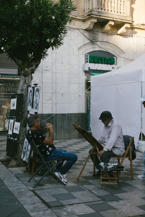 Men Sitting on the Street