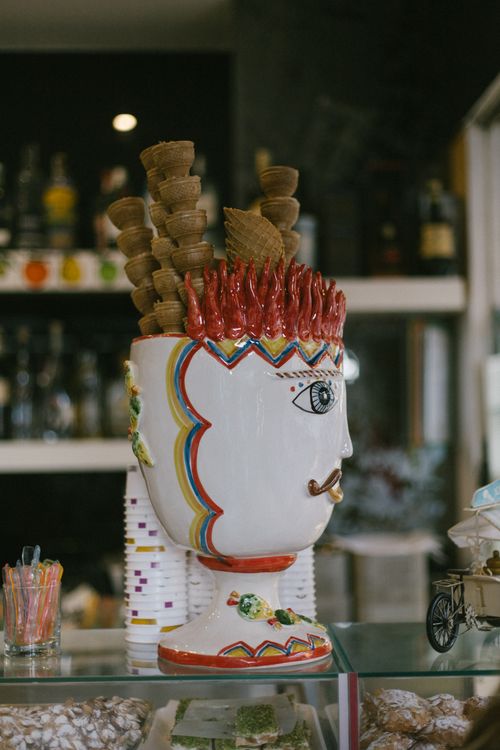 Free A colorful ceramic vase with ice cream cones in an ice cream parlor setting. Stock Photo