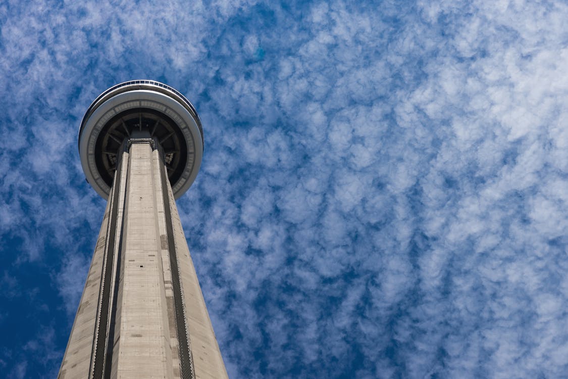 Free Gray and Black Concrete Tower Under White and Blue Sky Stock Photo