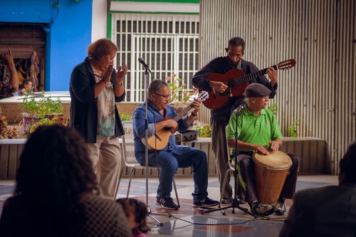 Free A diverse group of senior musicians performing outdoors in Venezuela, showcasing traditional musical talent. Stock Photo