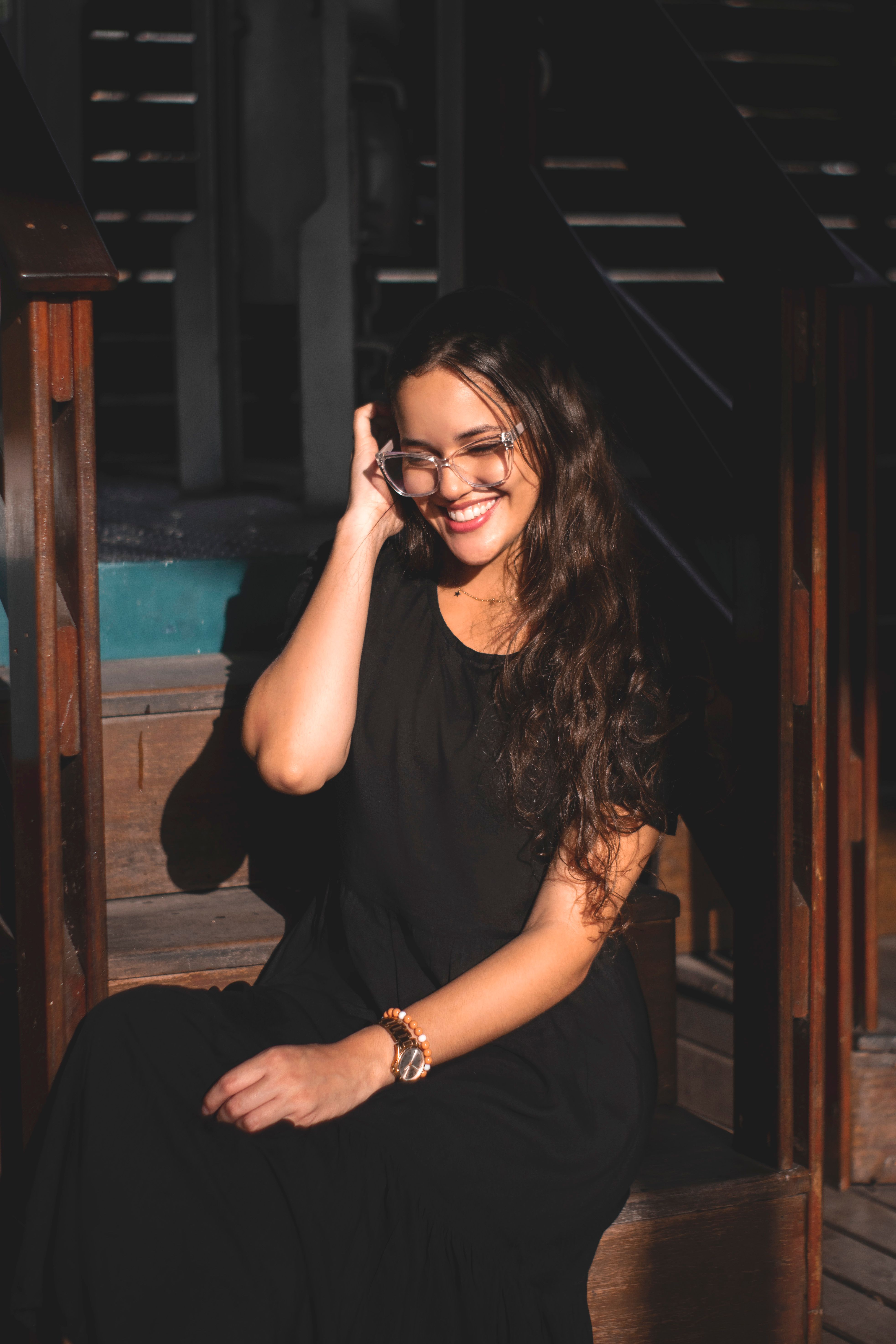 A Woman in Black Dress Smiling · Free Stock Photo