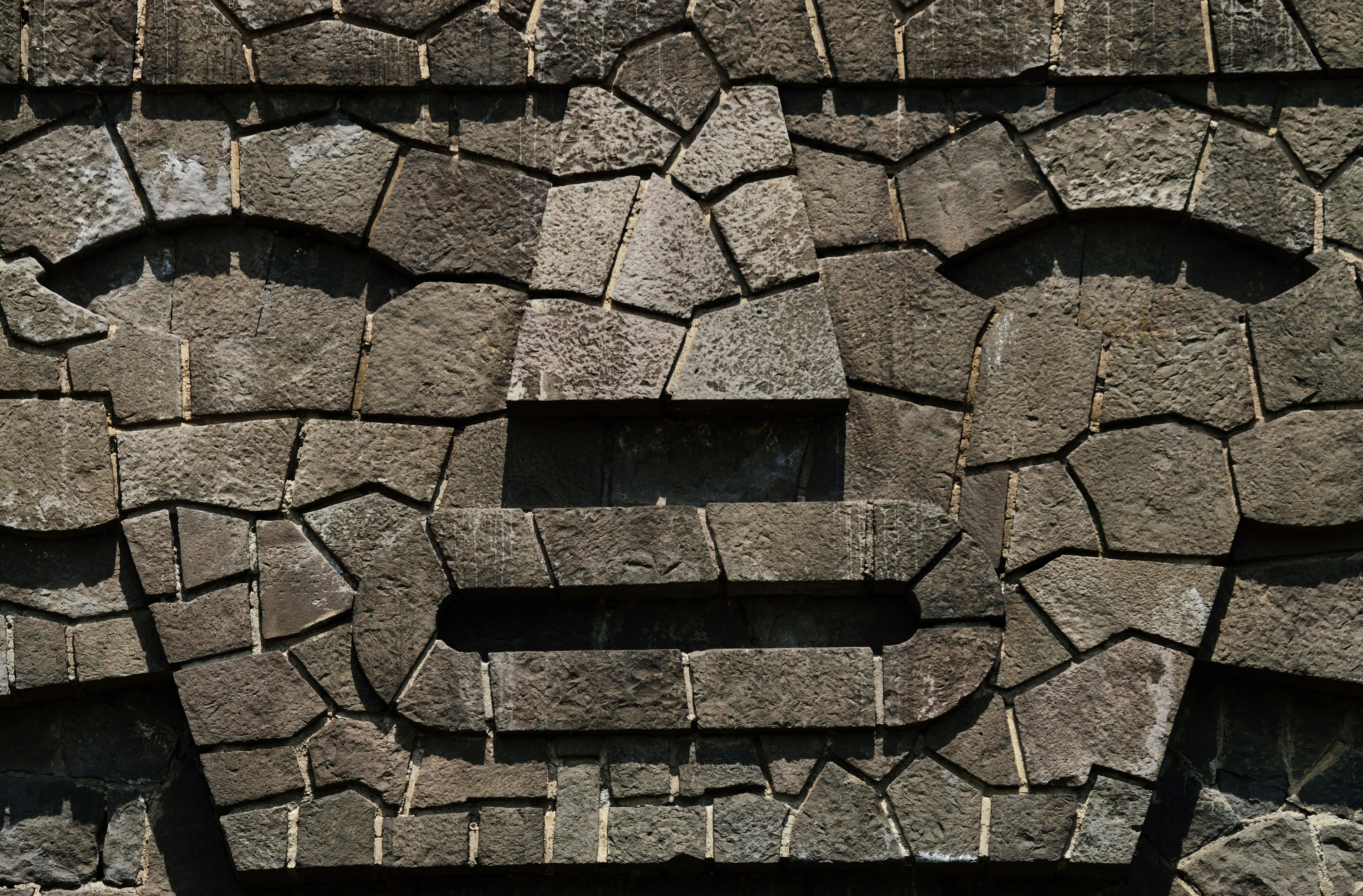 close up photography of gray concrete brick wall