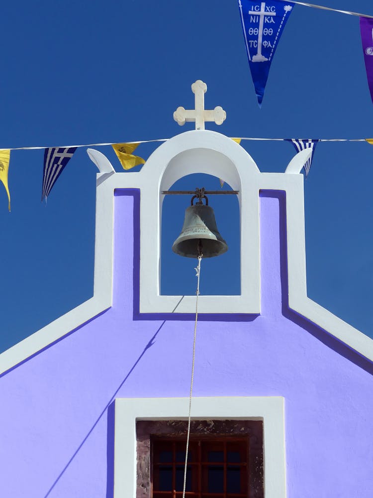 A Church Bell On Purple Wall