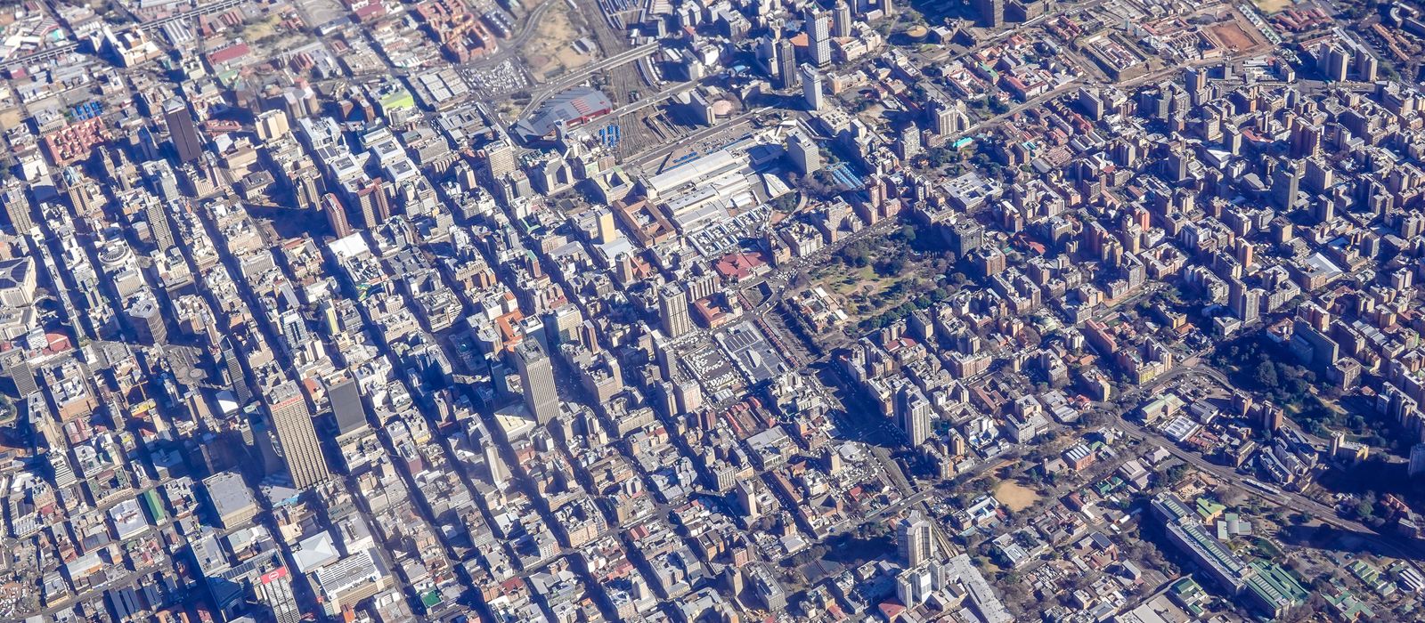 Aerial shot capturing the sprawling urban landscape of downtown Johannesburg, South Africa. — flights from Lusaka to Johannesburg
