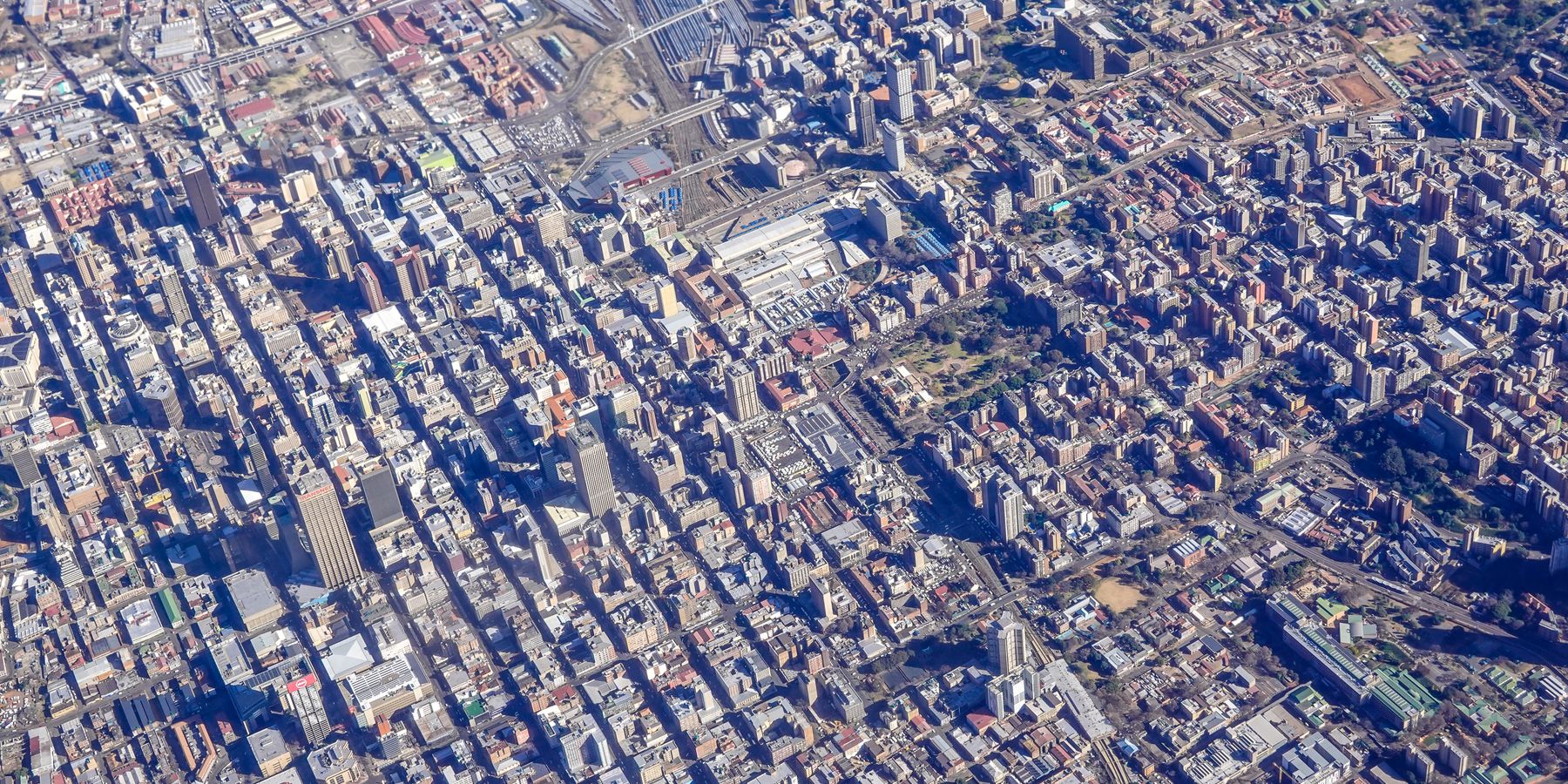 Aerial shot capturing the sprawling urban landscape of downtown Johannesburg, South Africa.