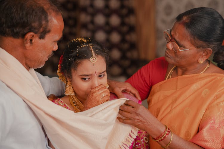 Indian Wedding Photo With A Crying Bride With Parents