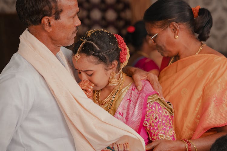 Indian Wedding Photo With A Crying Bride With Parents