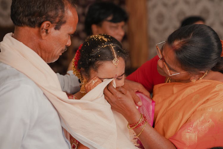 A Mother Wiping Her Daughter's Tears