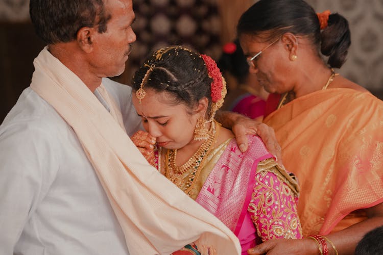 Indian Wedding Photo With A Crying Bride With Parents