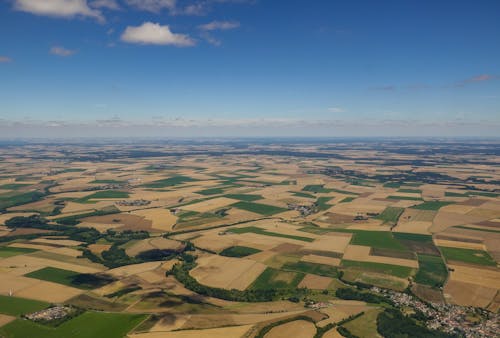 Aerial View of Croplands under a Blue Sky 