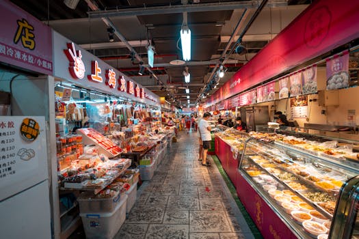 Explore a bustling Asian market with colorful food displays and busy shoppers.