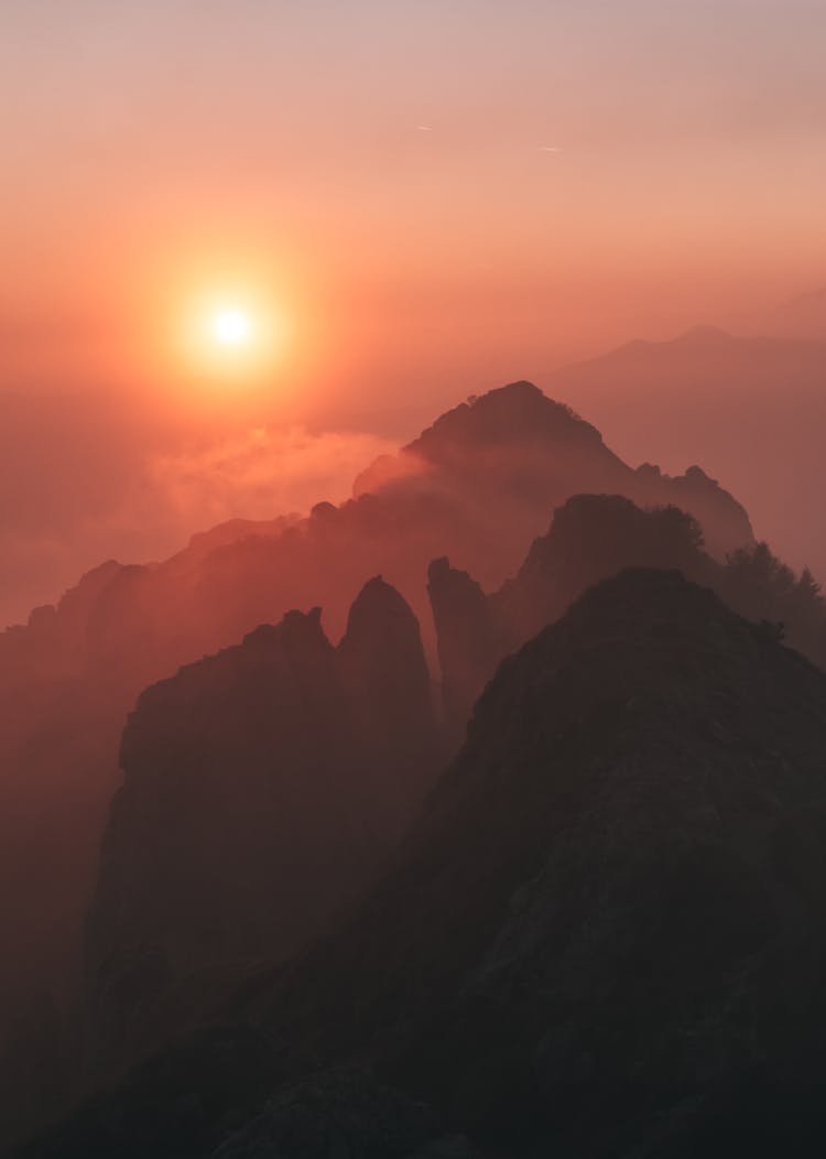 Silhouette Of Mountains During Sunset